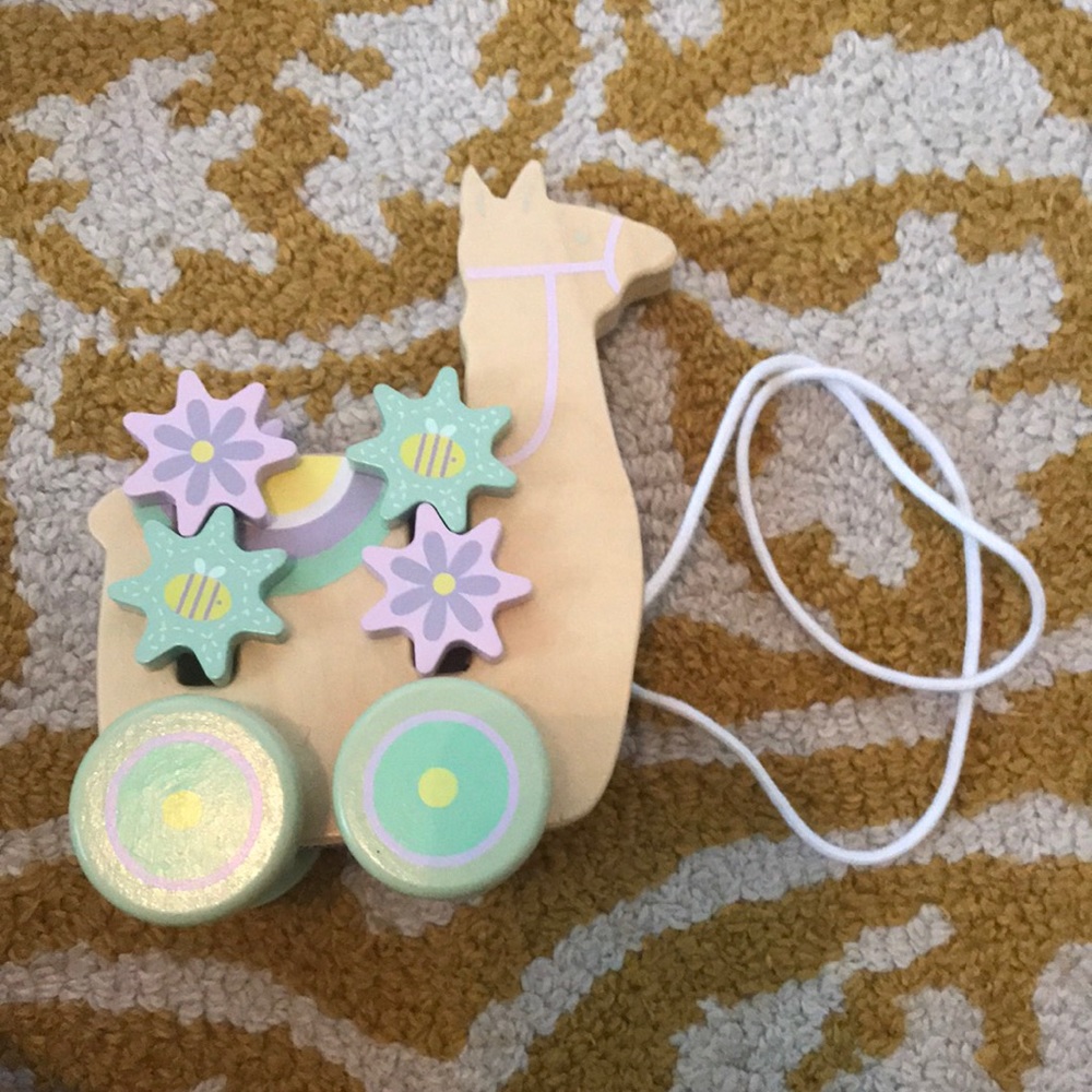 Pull along toy llama with removable gears